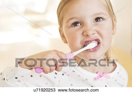 Young girl brushing teeth View Large Photo Image Stock Image - Young girl brushing teeth. Fotosearch