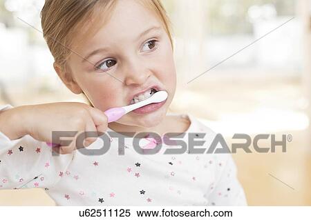 Young girl brushing teeth View Large Photo Image Stock Photography - Young girl brushing teeth. Fotosearch