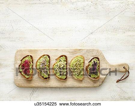 Bruschetta on a wooden chopping board View Large Photo Image Stock Photography - Bruschetta on a wooden chopping board. Fotosearch