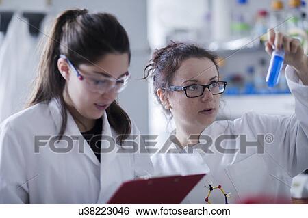 Stock Photograph - Female scientists in laboratory. Fotosearch
