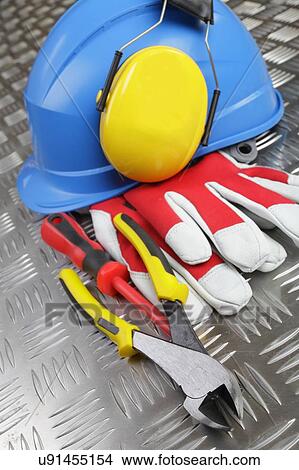 Picture - Hardhat and tools. Fotosearch