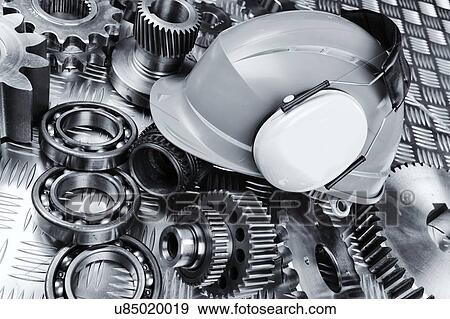 Hardhat with industrial gear parts View Large Photo Image Stock Photo - Hardhat with industrial gear parts. Fotosearch