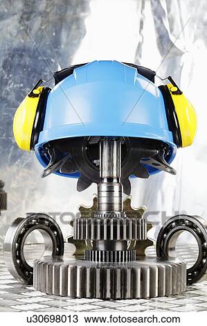 Stock Image - Hardhat with industrial gears. Fotosearch