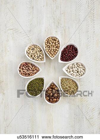 Stock Image - Pulses in tear shaped mini bowls. Fotosearch