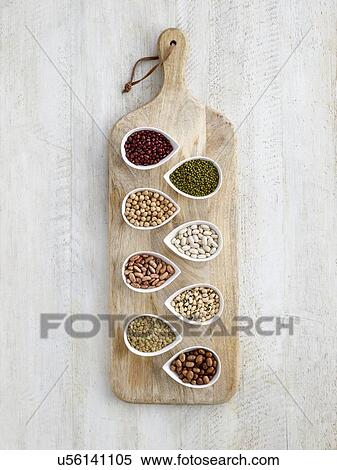 Stock Photography - Pulses in tear shaped mini bowls. Fotosearch