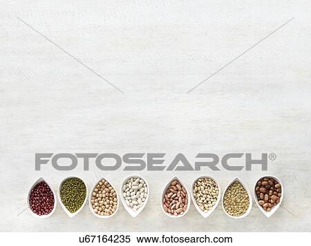 Stock Photography - Pulses in tear shaped mini bowls. Fotosearch