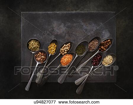 Pulses on metal spoons View Large Photo Image Stock Photo - Pulses on metal spoons. Fotosearch