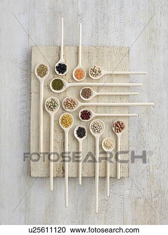 Pulses on wooden spoons View Large Photo Image Stock Image - Pulses on wooden spoons. Fotosearch