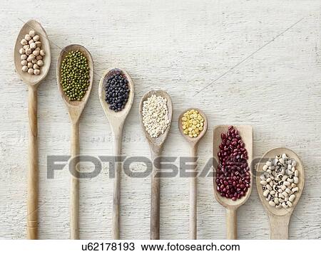 Pulses on wooden spoons View Large Photo Image Stock Image - Pulses on wooden spoons. Fotosearch