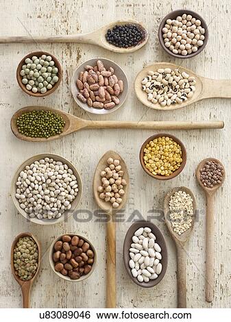 Stock Photograph - Pulses on wooden spoons. Fotosearch