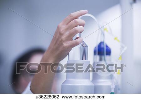 Stock Image - Radiologist checking equipment. Fotosearch