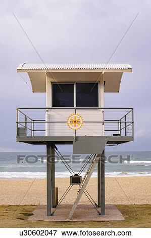Stock Photo - Australia, New South Wales, Lifeguard hut against storm clouds. Fotosearch