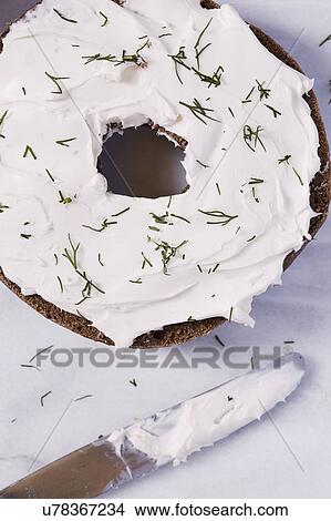 Bagel with cream cheese and dill View Large Photo Image Picture - Bagel with cream cheese and dill. Fotosearch