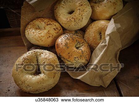 Stock Image - Bagels lying on table. Fotosearch