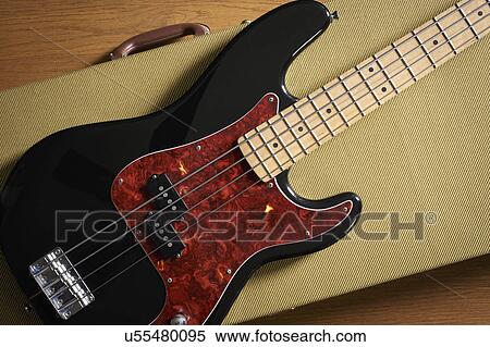 Bass guitar lying on guitar case View Large Photo Image Stock Photography - Bass guitar lying on guitar case. Fotosearch