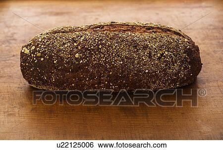 Stock Photograph - Bread on wooden table. Fotosearch