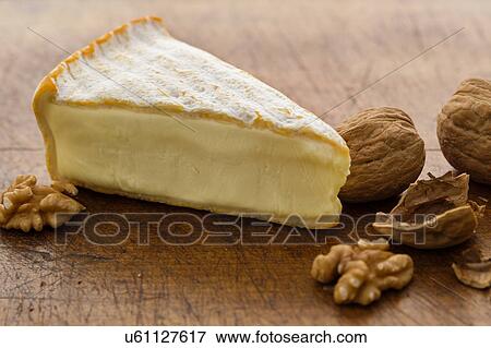 Stock Photo - Brie cheese with walnuts. Fotosearch
