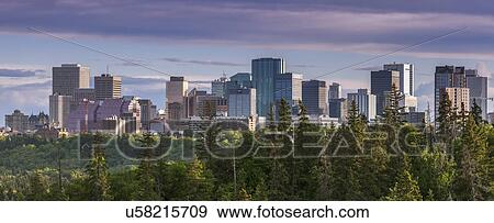 Canada, Alberta, Edmonton, Cityscape with trees in foreground View Large Photo Image Stock Photo - Canada, Alberta, Edmonton, Cityscape with trees in foreground. Fotosearch