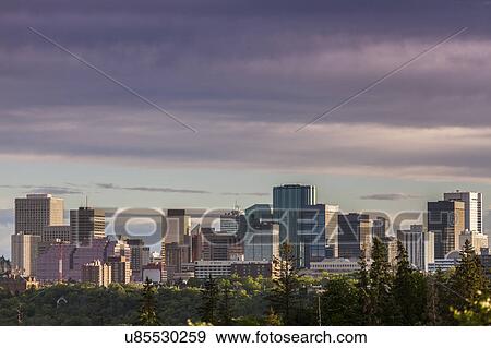 Stock Photo - Canada, Alberta, Edmonton, Cityscape with moody sky. Fotosearch