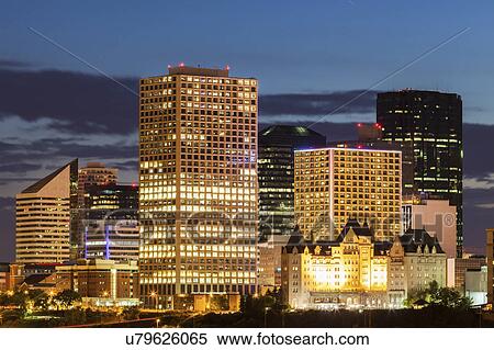 Stock Photography - Canada, Alberta, Edmonton, Illuminated office buildings at dusk. Fotosearch