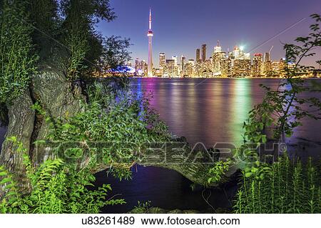 Stock Photo - Canada, Ontario, Toronto, Modern city reflected in water. Fotosearch