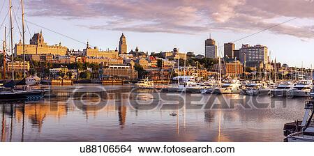 Canada, Quebec, Quebec City, Coastline with marina and buildings reflected in water View Large Photo Image Picture - Canada, Quebec, Quebec City, Coastline with marina and buildings reflected in water. Fotosearch