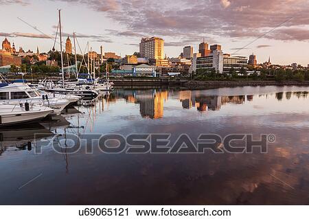 Stock Image - Canada, Quebec, Quebec City, Coastline with marina and architecture. Fotosearch