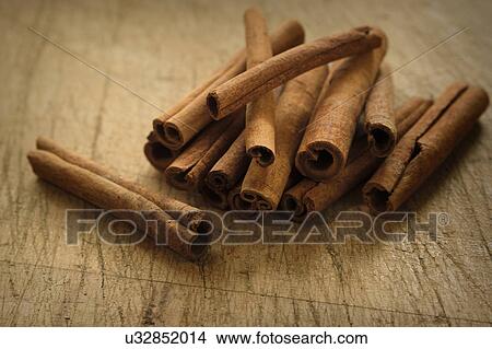 Cinnamon sticks on wooden table View Large Photo Image Picture - Cinnamon sticks on wooden table. Fotosearch