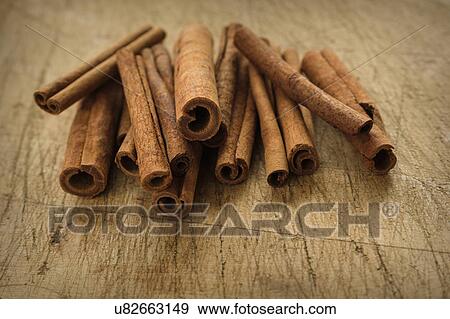 Stock Photo - Cinnamon sticks on wooden table. Fotosearch