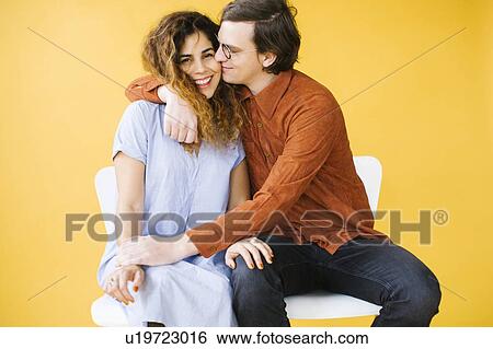 Stock Photograph - Couple embracing in studio. Fotosearch