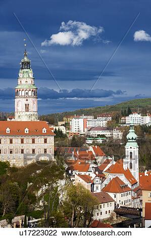 Stock Image - Czech Republic, South Bohemia, Cesky Krumlov, Castle against storm clouds. Fotosearch