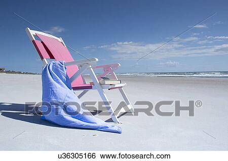 Deckchair on empty beach View Large Photo Image Stock Photograph - Deckchair on empty beach. Fotosearch