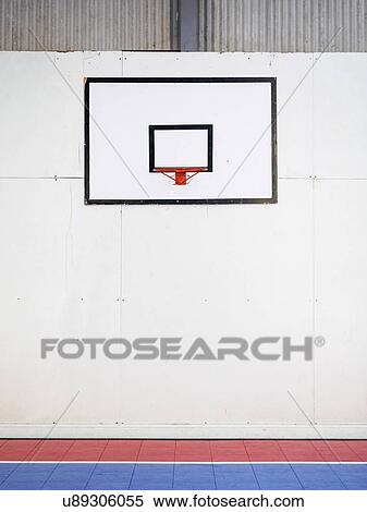 Empty basketball court with basketball hoop hanging on wall View Large Photo Image Stock Photography - Empty basketball court with basketball hoop hanging on wall. Fotosearch