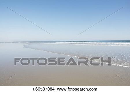 Empty beach on sunny day View Large Photo Image Picture - Empty beach on sunny day. Fotosearch