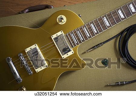 Gibson Les Paul and music equipment lying on guitar case View Large Photo Image Picture - Gibson Les Paul and music equipment lying on guitar case. Fotosearch