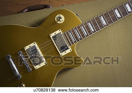Stock Photo - Gibson Les Paul lying on guitar case. Fotosearch