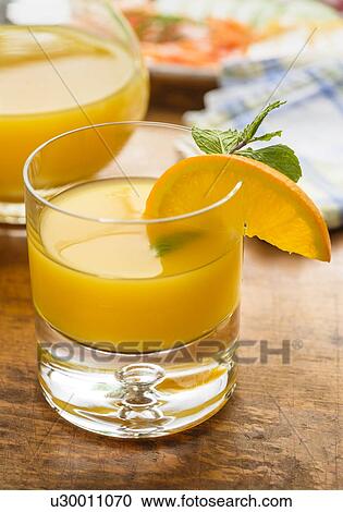 Glass of orange juice View Large Photo Image Stock Image - Glass of orange juice. Fotosearch