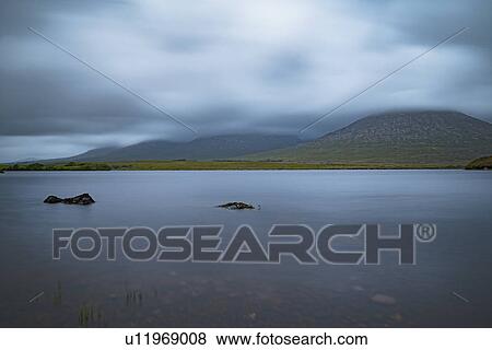 Ireland, Galway County, Connemara, Clouds over lake View Large Photo Image Stock Photo - Ireland, Galway County, Connemara, Clouds over lake. Fotosearch