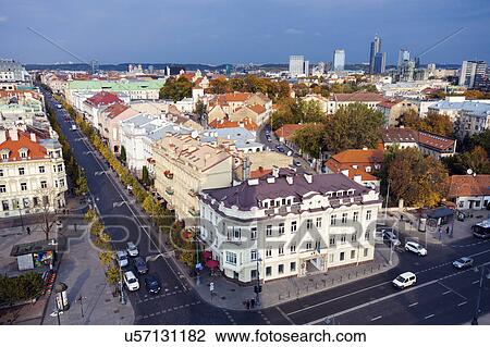Stock Image - Lithuania, Vilnius, Old architecture of town with skyscrapers in background. Fotosearch