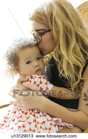 Mother kissing daughter (12-17) View Large Photo Image Stock Image - Mother kissing daughter (12-17). Fotosearch