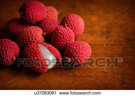 Organic lychee on wooden table View Large Photo Image Stock Image - Organic lychee on wooden table. Fotosearch