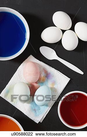 Paints prepared to dye eggs in different colors View Large Photo Image Stock Image - Paints prepared to dye eggs in different colors. Fotosearch