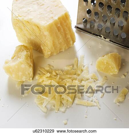 Parmesan cheese and grater View Large Photo Image Stock Photo - Parmesan cheese and grater. Fotosearch