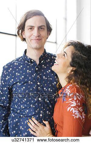 Portrait of couple against window View Large Photo Image Stock Image - Portrait of couple against window. Fotosearch