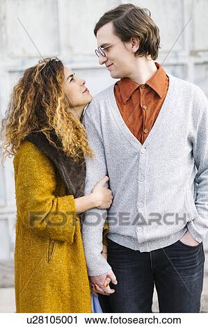 Portrait of couple looking at each other View Large Photo Image Stock Image - Portrait of couple looking at each other. Fotosearch