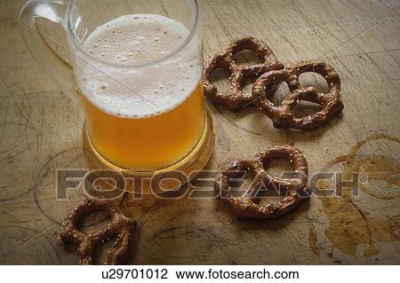 Stock Image - Pretzels and beer mug. Fotosearch