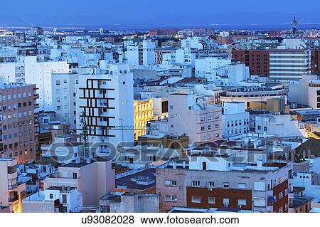 Stock Photo - Spain, Andalusia, Almeria, Residential district at dusk. Fotosearch