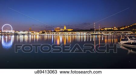 Stock Image - Spain, Andalusia, Seville, Skyline at dusk. Fotosearch