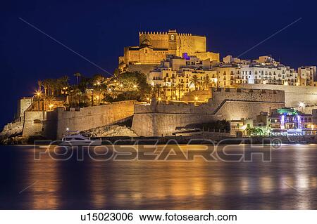 Spain, Valencian Community, Peniscola, Waterfront with fortified wall at night View Large Photo Image Stock Photograph - Spain, Valencian Community, Peniscola, Waterfront with fortified wall at night. Fotosearch