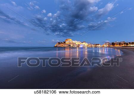 Spain, Valencian Community, Peniscola, Illuminated town by sea View Large Photo Image Stock Photograph - Spain, Valencian Community, Peniscola, Illuminated town by sea. Fotosearch